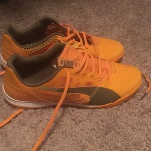 Orange puma athletic shoes